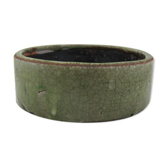 Bowl or empty pocket in cracked green sandstone varnish raku