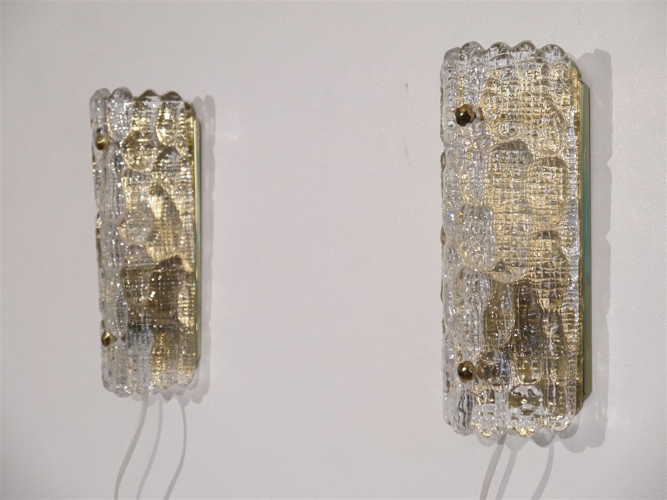Pair of crystal and brass wall lamps by Carl Fagerlund for Orrefors