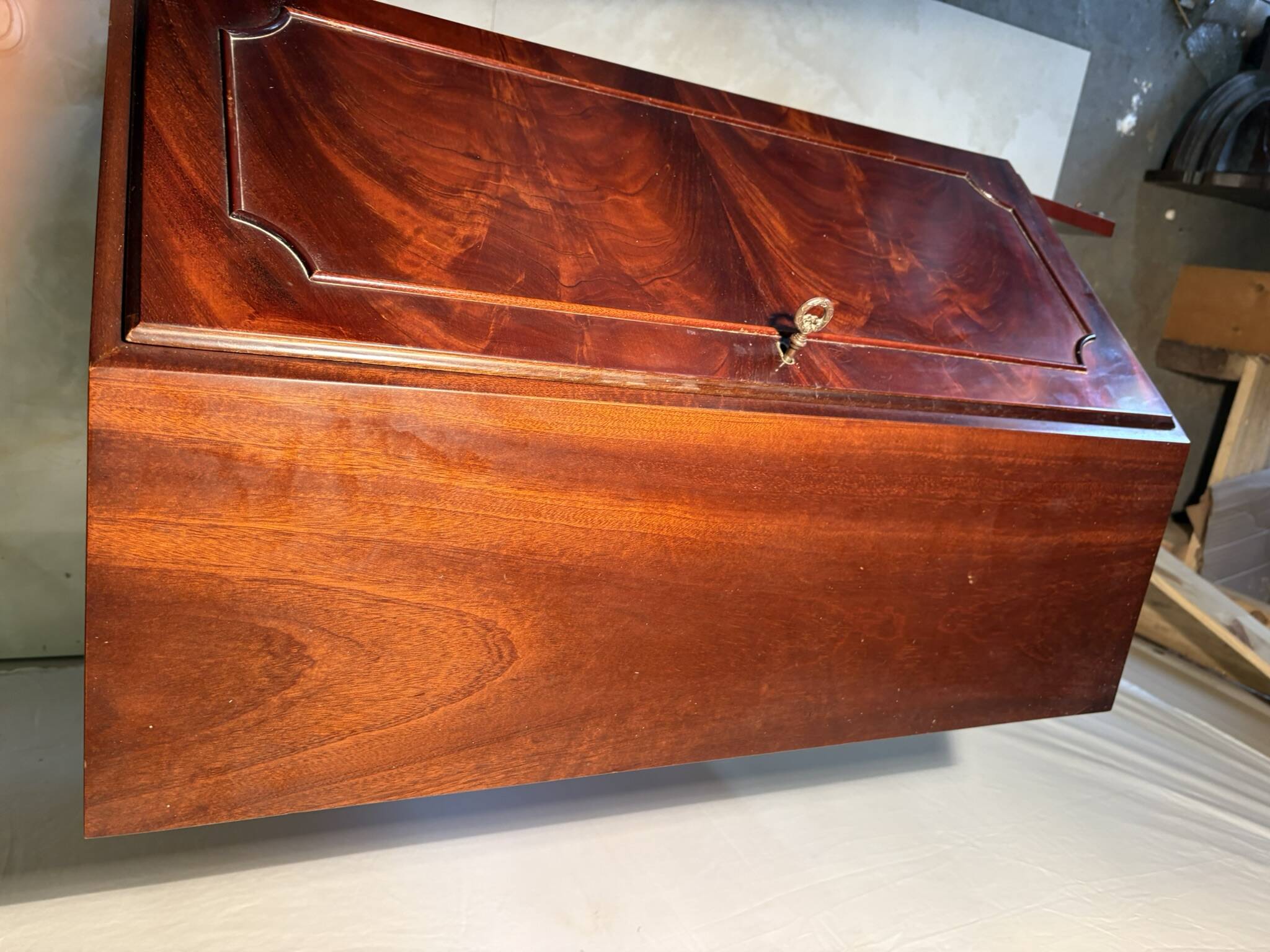 Antique mahogany secretary, upholstered flap and interior storage