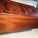 Antique mahogany secretary, upholstered flap and interior storage