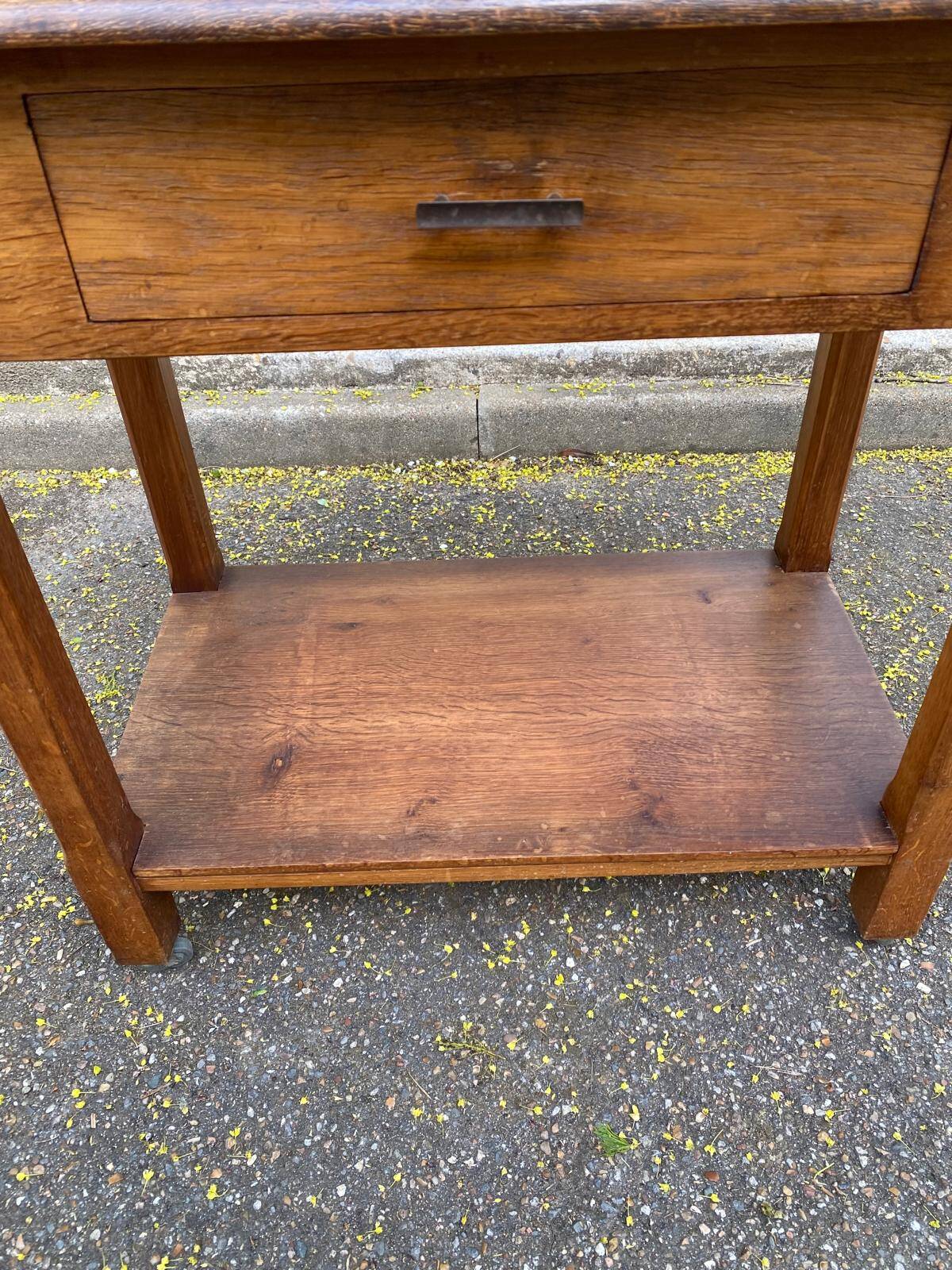 Vintage farmhouse dessert trolley on wheels made of solid wood from the 19th century.