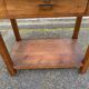 Vintage farmhouse dessert trolley on wheels made of solid wood from the 19th century.