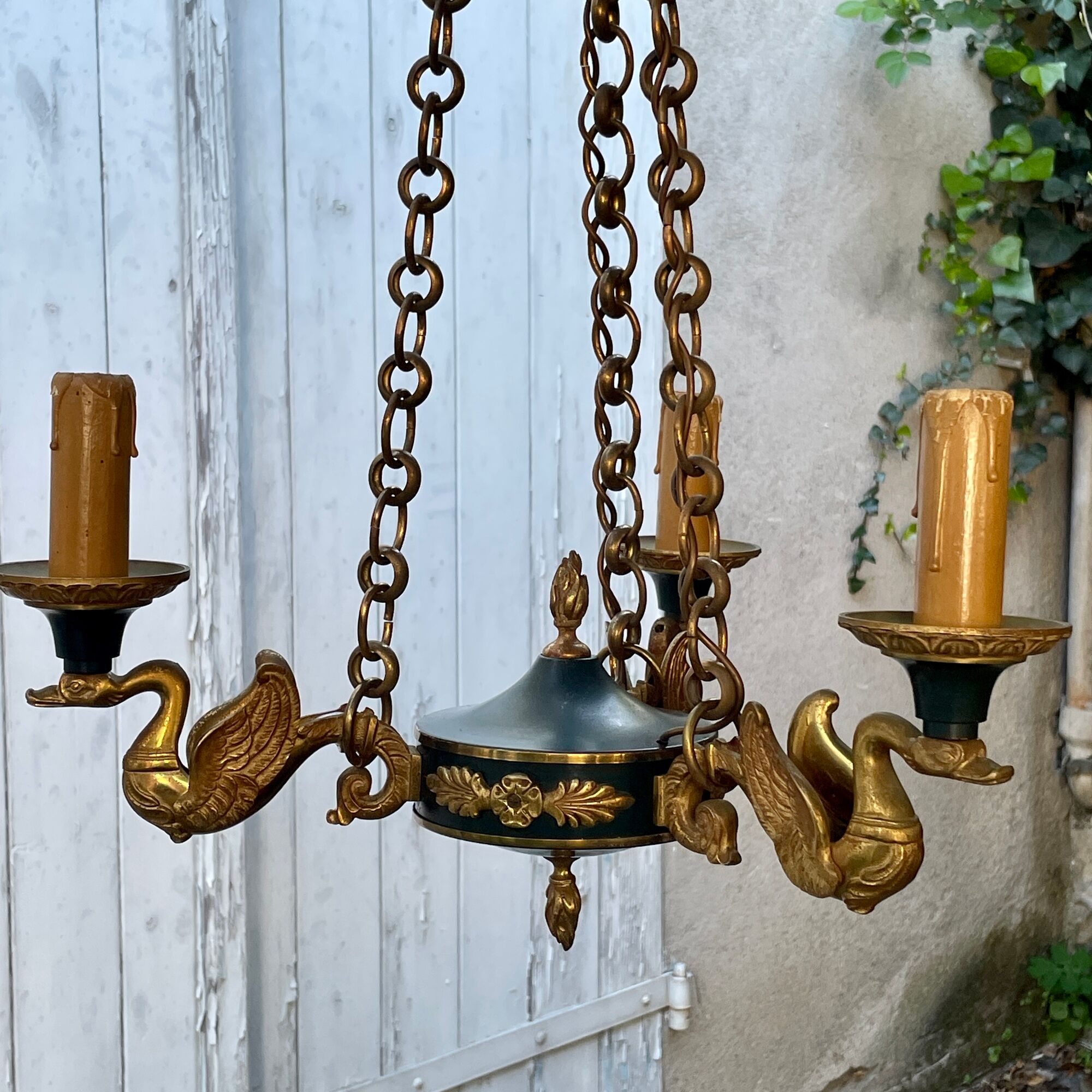Lucien gau chandelier pendant lamp in bronze with swan decoration.