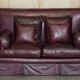 Victorian Knole canapé restored in leather with feather cushions.