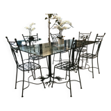 Wrought iron table with tree sculpture and glass top