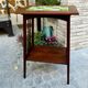 Art Nouveau side table 1910 with double tops in dark oak.