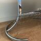 Space Age coffee table in chrome metal and smoked glass with magazine rack – Circa 1970