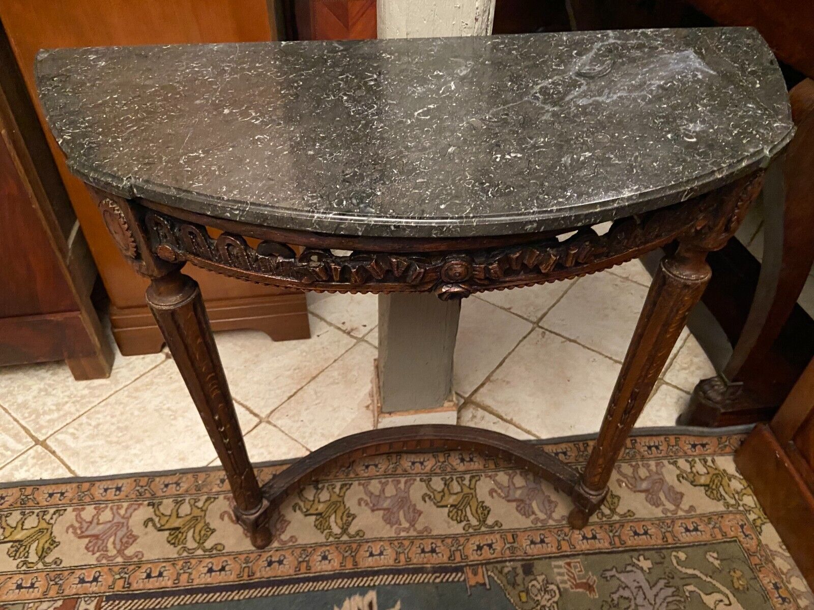 Half-moon console eighteenth century solid oak with carved decoration Louis XVI era