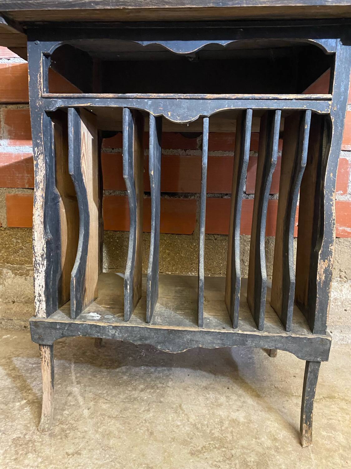 Antique writing desk, blackened wooden filing cabinet.