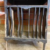 Antique writing desk, blackened wooden filing cabinet.