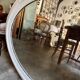 Oval mirror in pearl-coloured stucco 85 x 114 cm