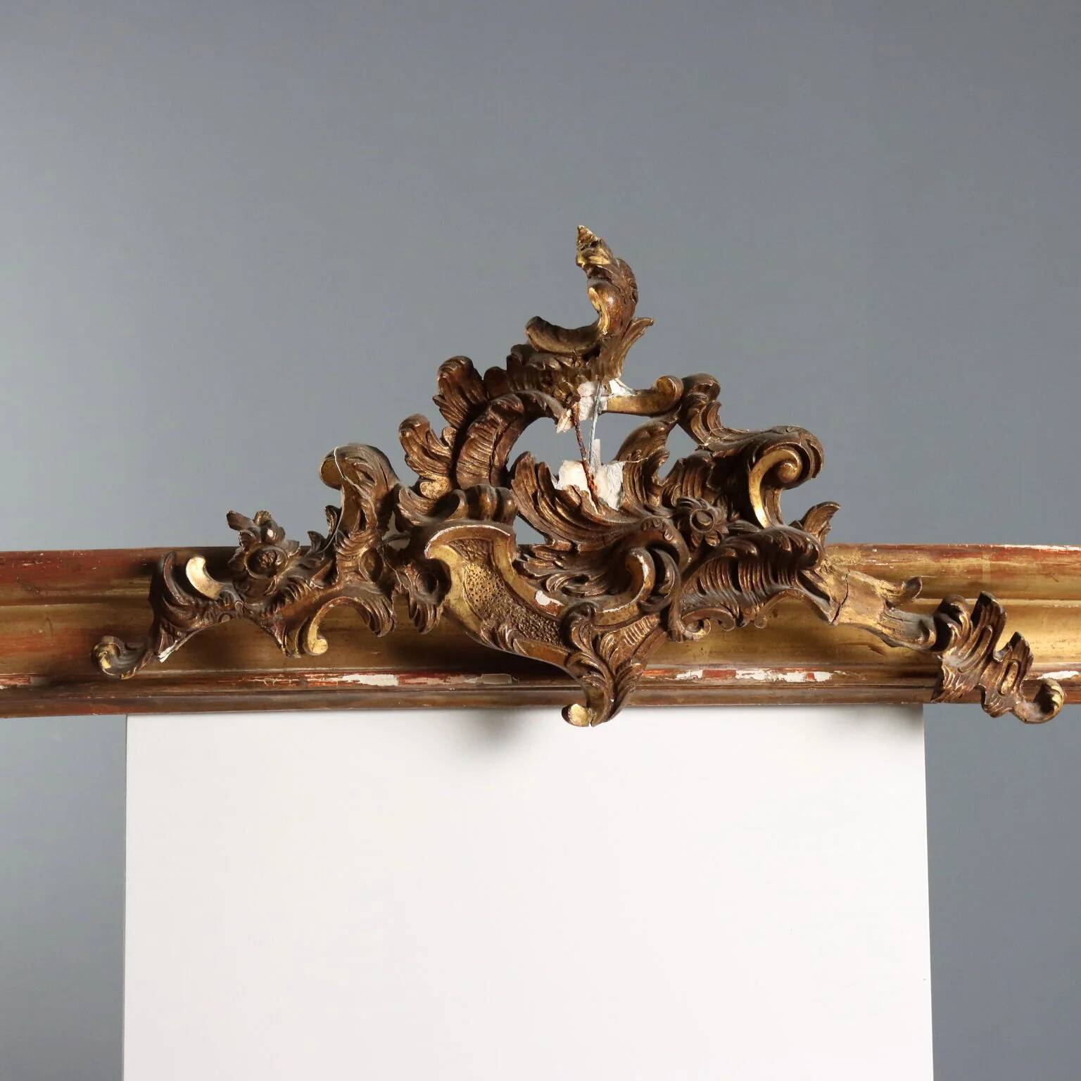 Golden wooden cornice with rocaille carving