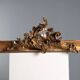 Golden wooden cornice with rocaille carving