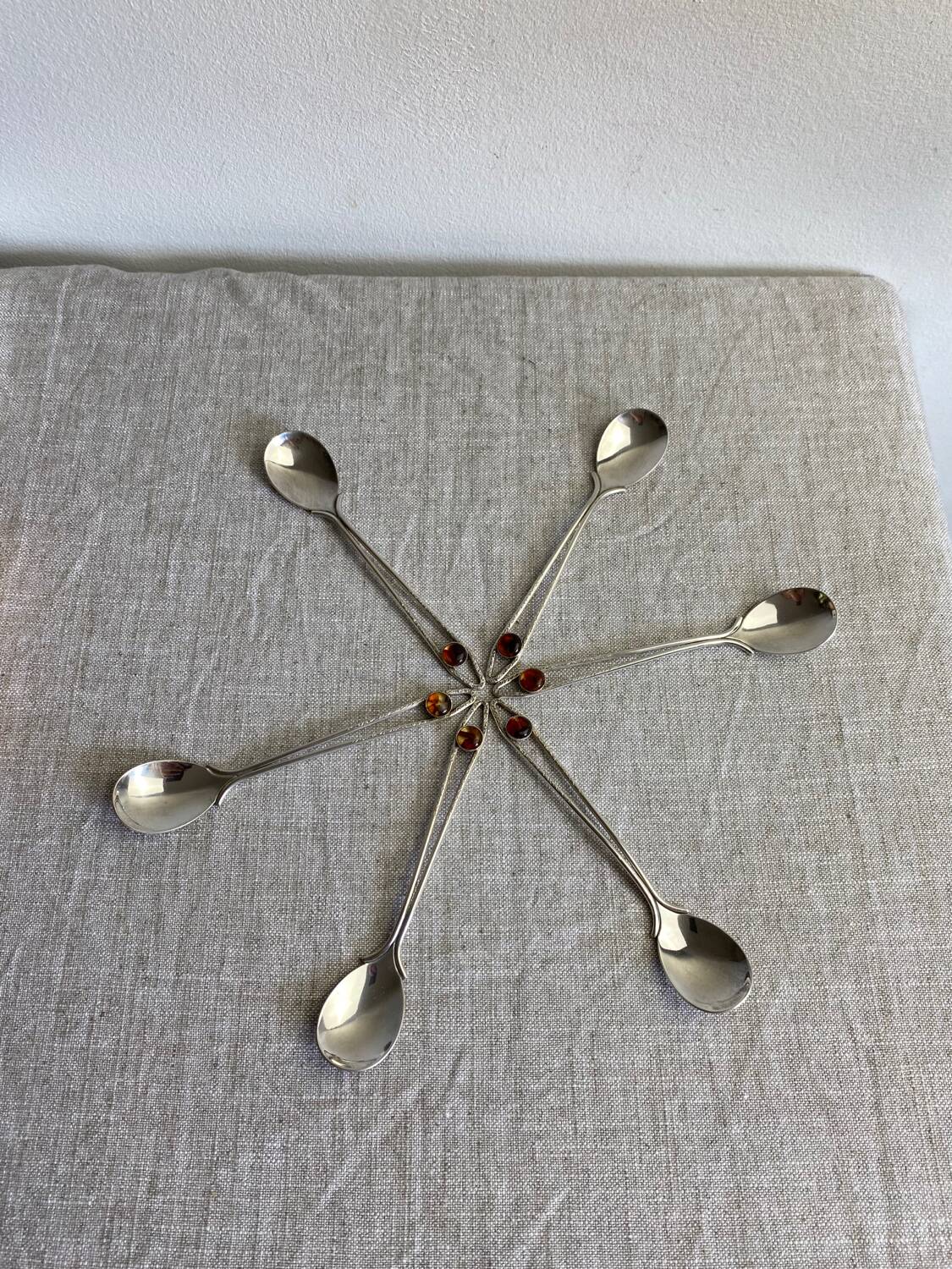 Art Nouveau metal and amber spoons