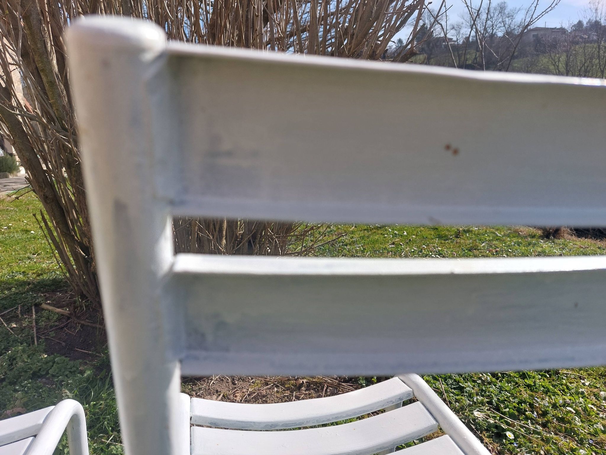 pair of white metal chairs, Tolix style