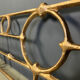 Architectural brutalist wall mounted sculpture made from cast metal.