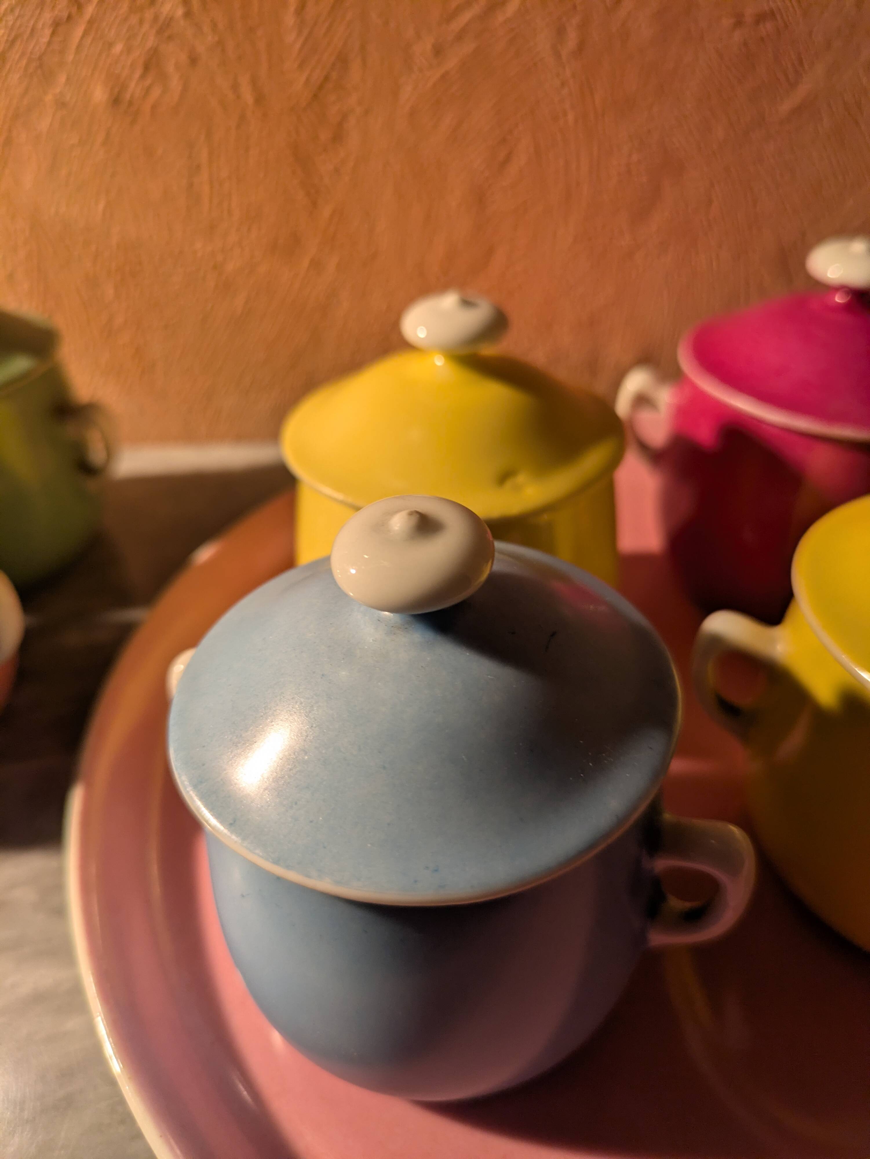 6 small porcelain cream pots from Limoges with a tray.