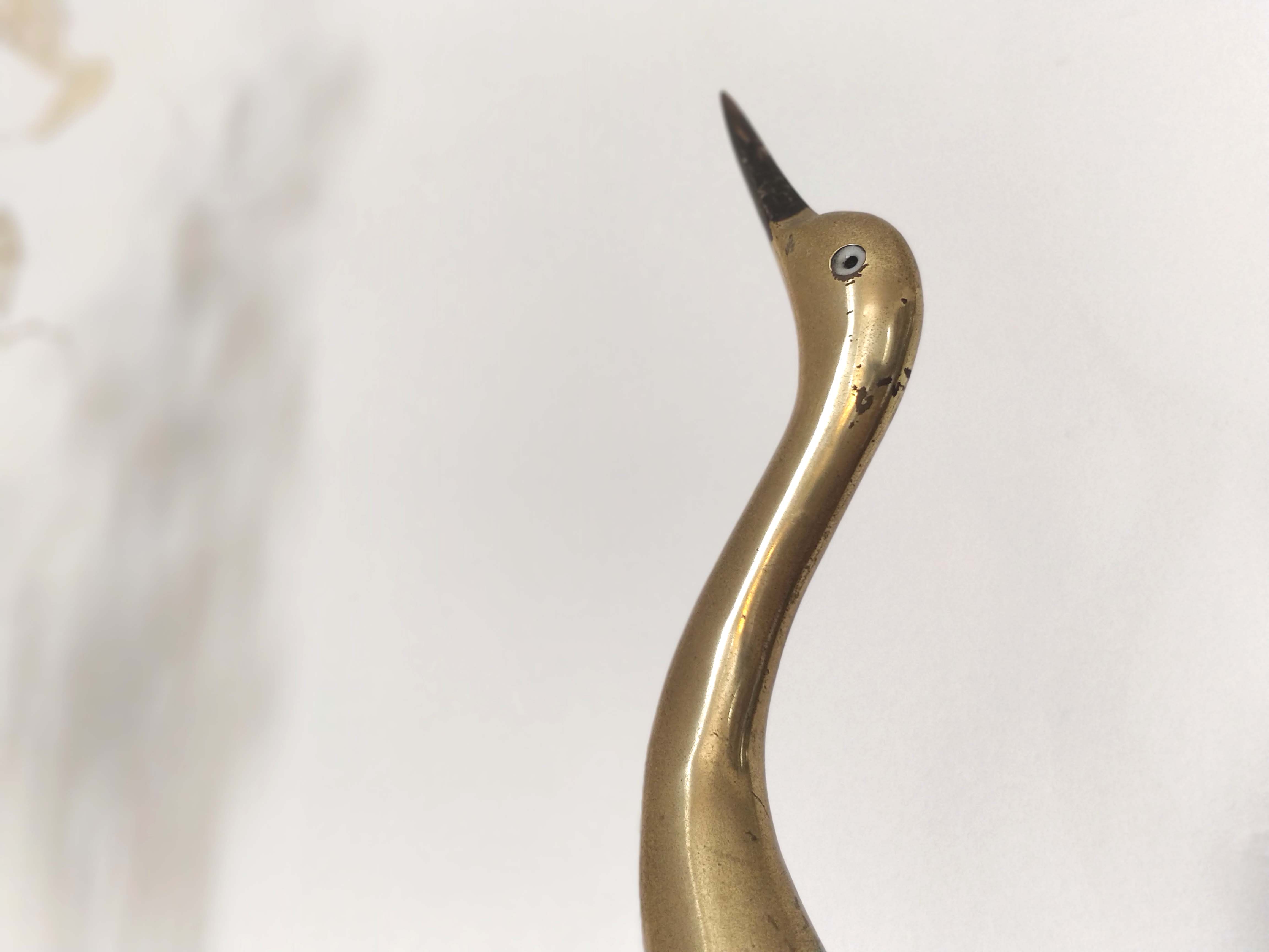 Large wooden and brass heron