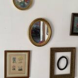 Oval mirror in gilded wood.