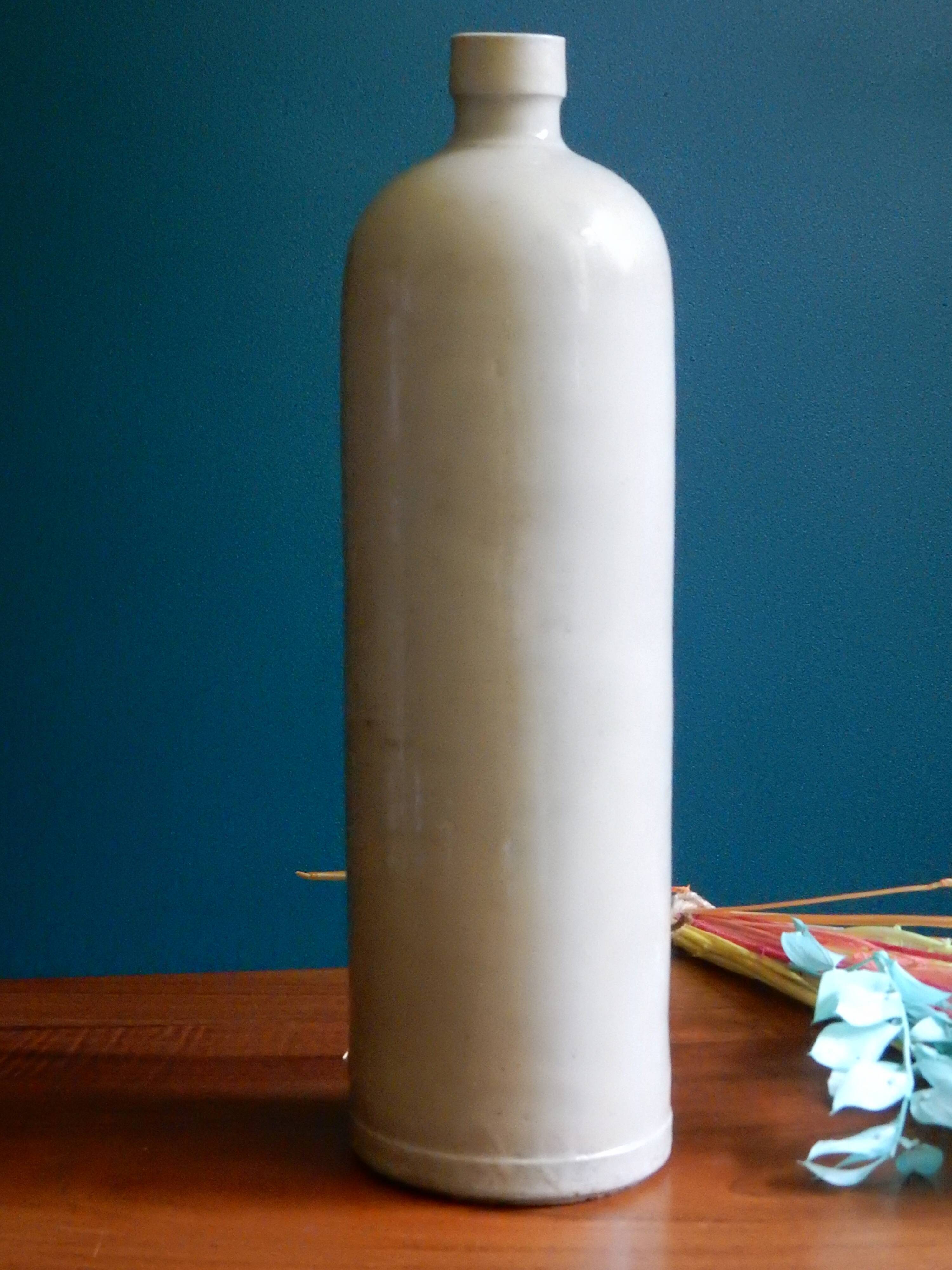 Enamelled white stoneware bottle