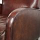 Dark cognac-coloured set of 2 sheepskin armchairs with a sleek design