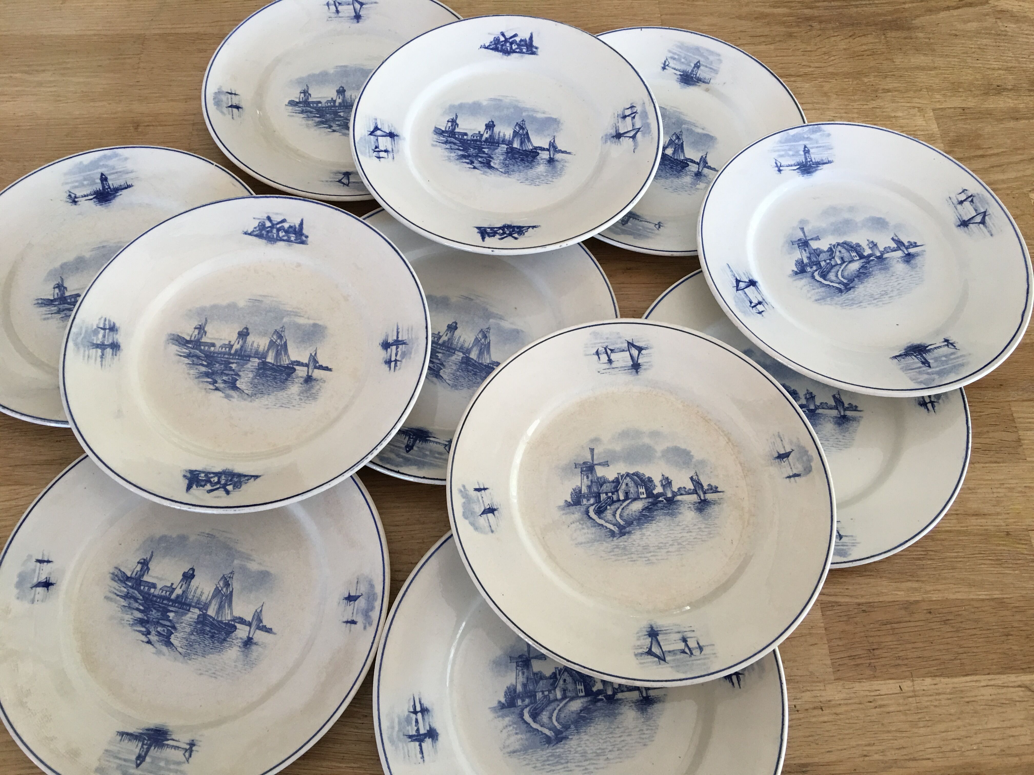 Series of 11 flat plates, Dutch earthenware, early XX