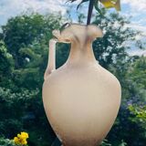 Old decorative carafe in li-colored glass