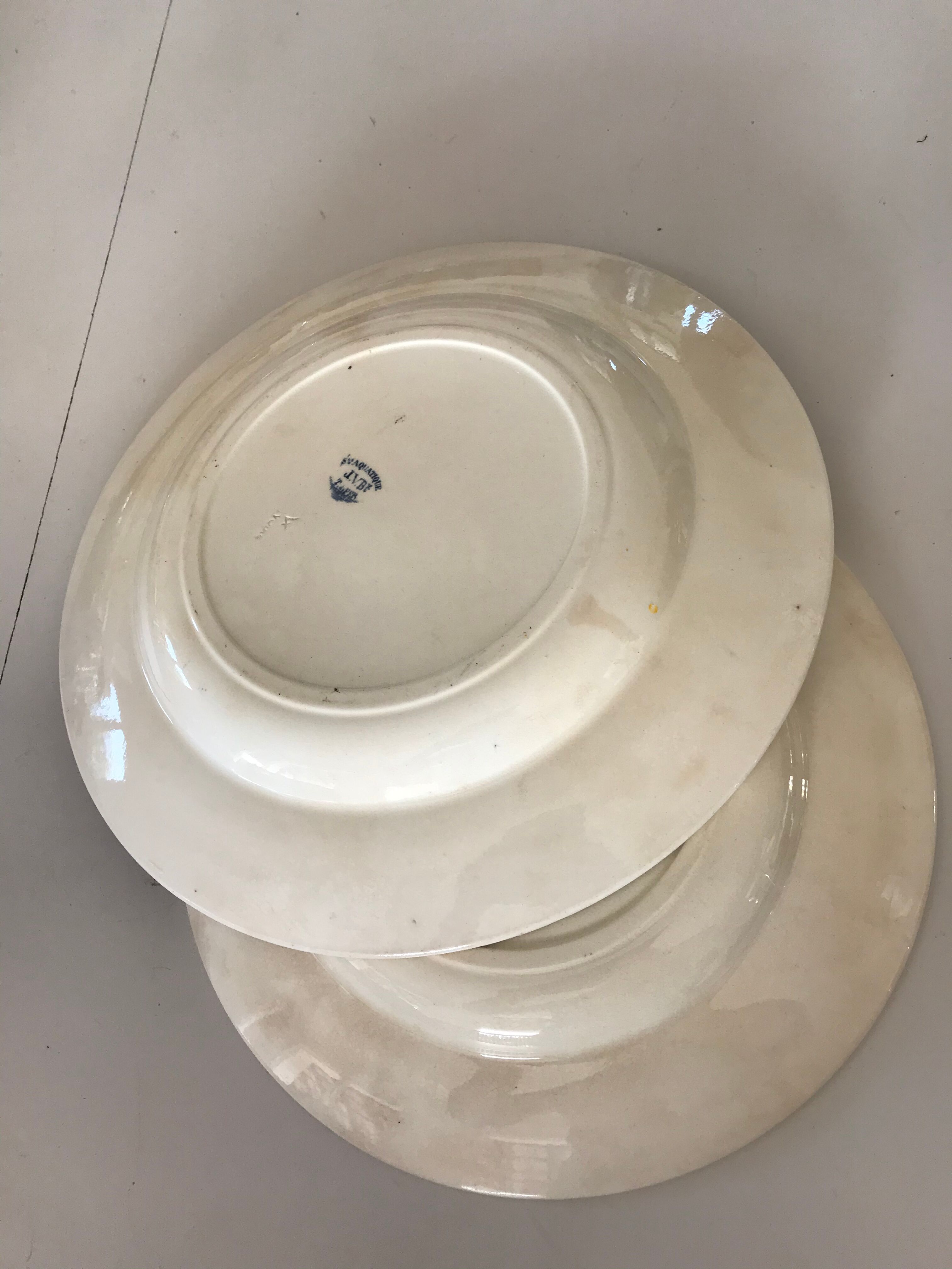 Two iron earth dishes