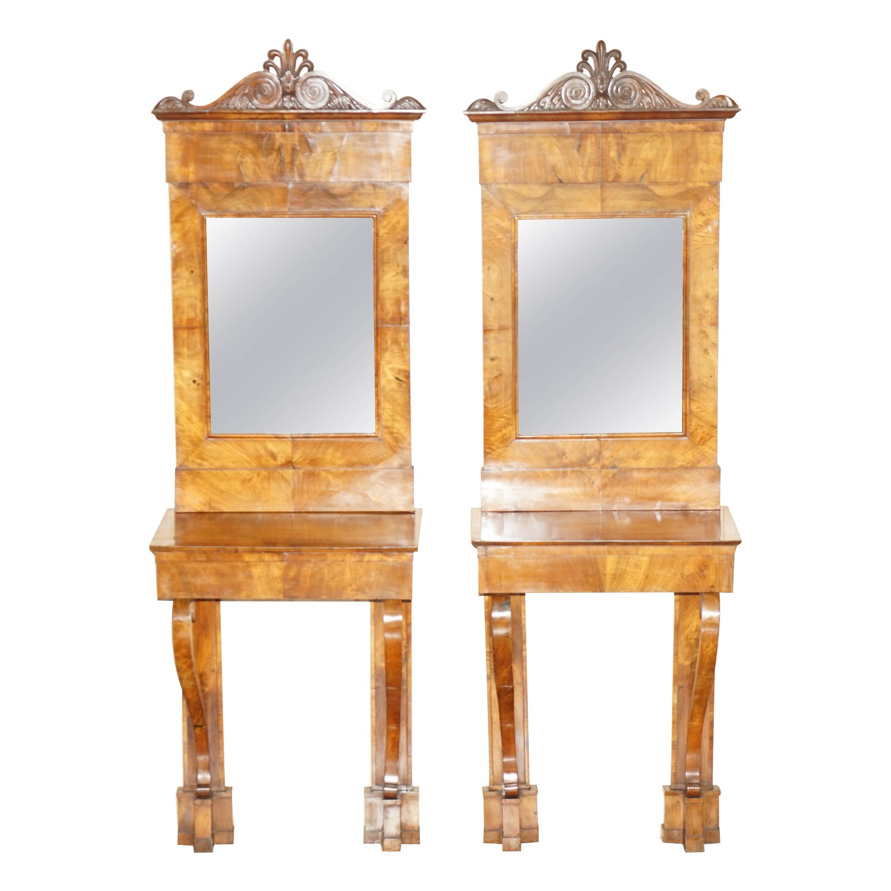 Pair of restored antique consoles from around 1815 in walnut, Regency style with mirror.
