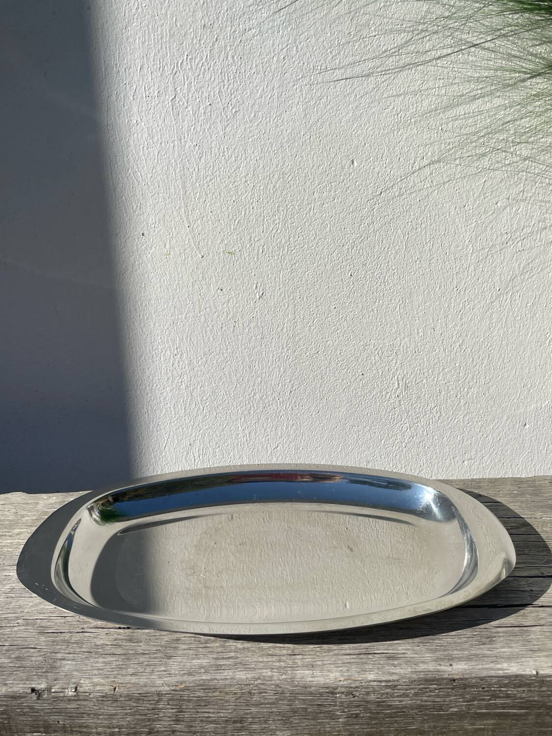 Oval stainless steel dish signed Rémi Letang