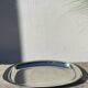Oval stainless steel dish signed Rémi Letang