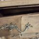 Stripped chest of drawers with bronze handles