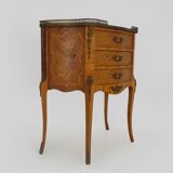 Baroque style wooden chest of drawers with bronze frieze.