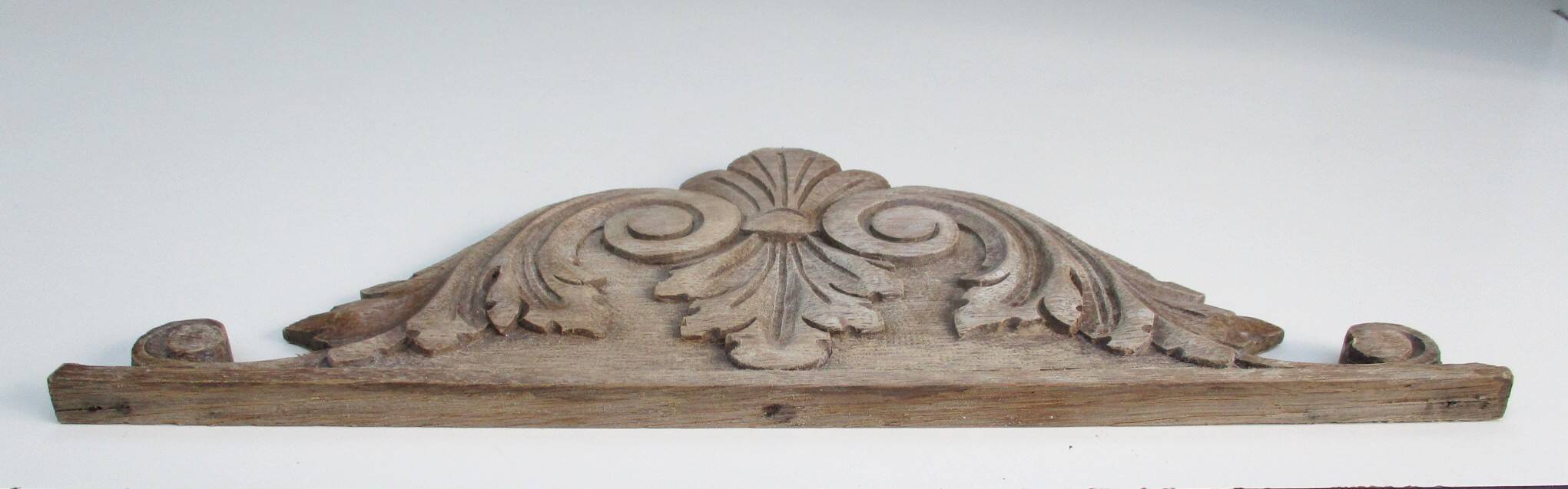 Old carved wooden pediment
