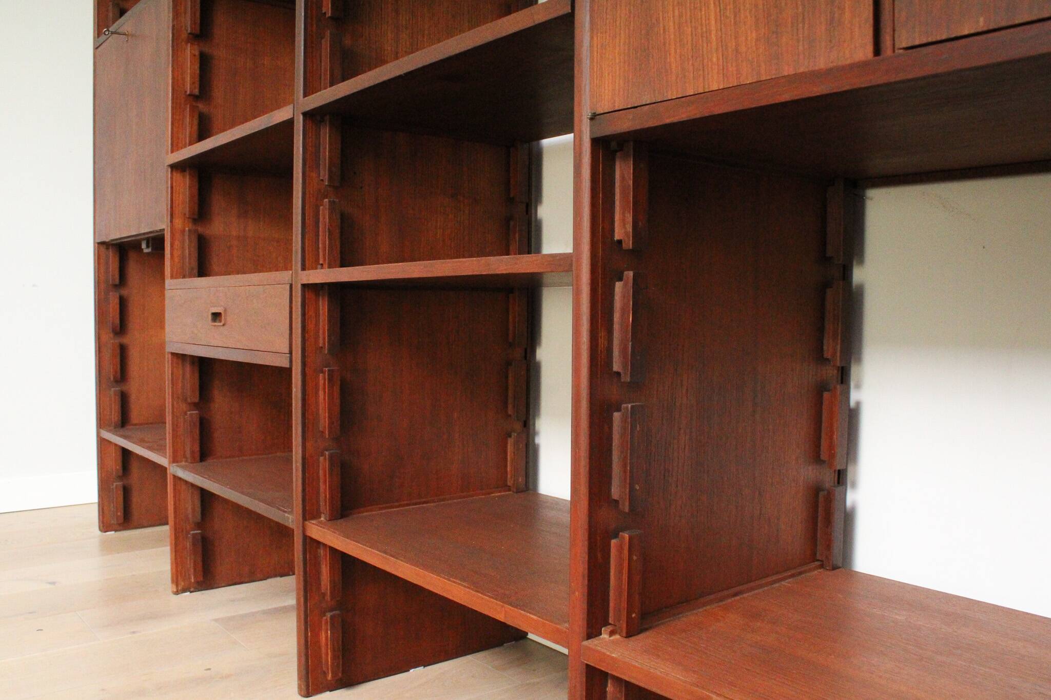 A vintage mid-century teak Gianfranco Frattini style bookcase room divider