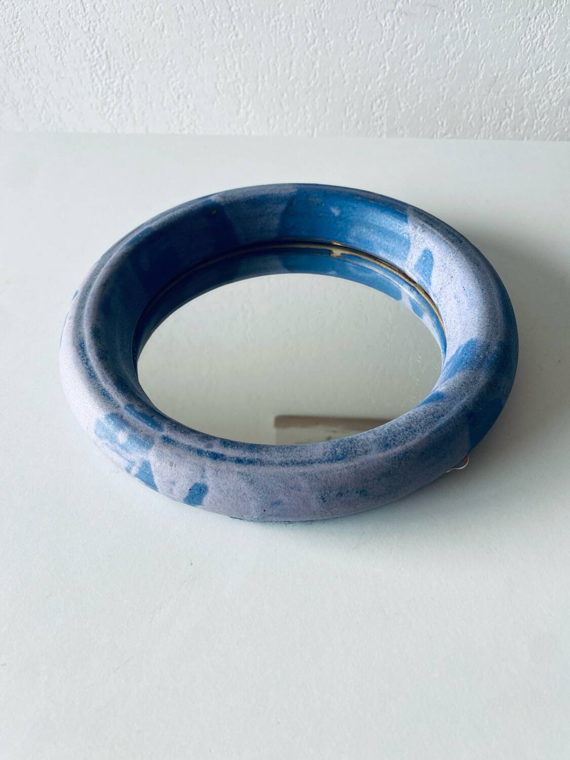 Round ceramic wall mirror