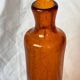 Biot blown glass bottle