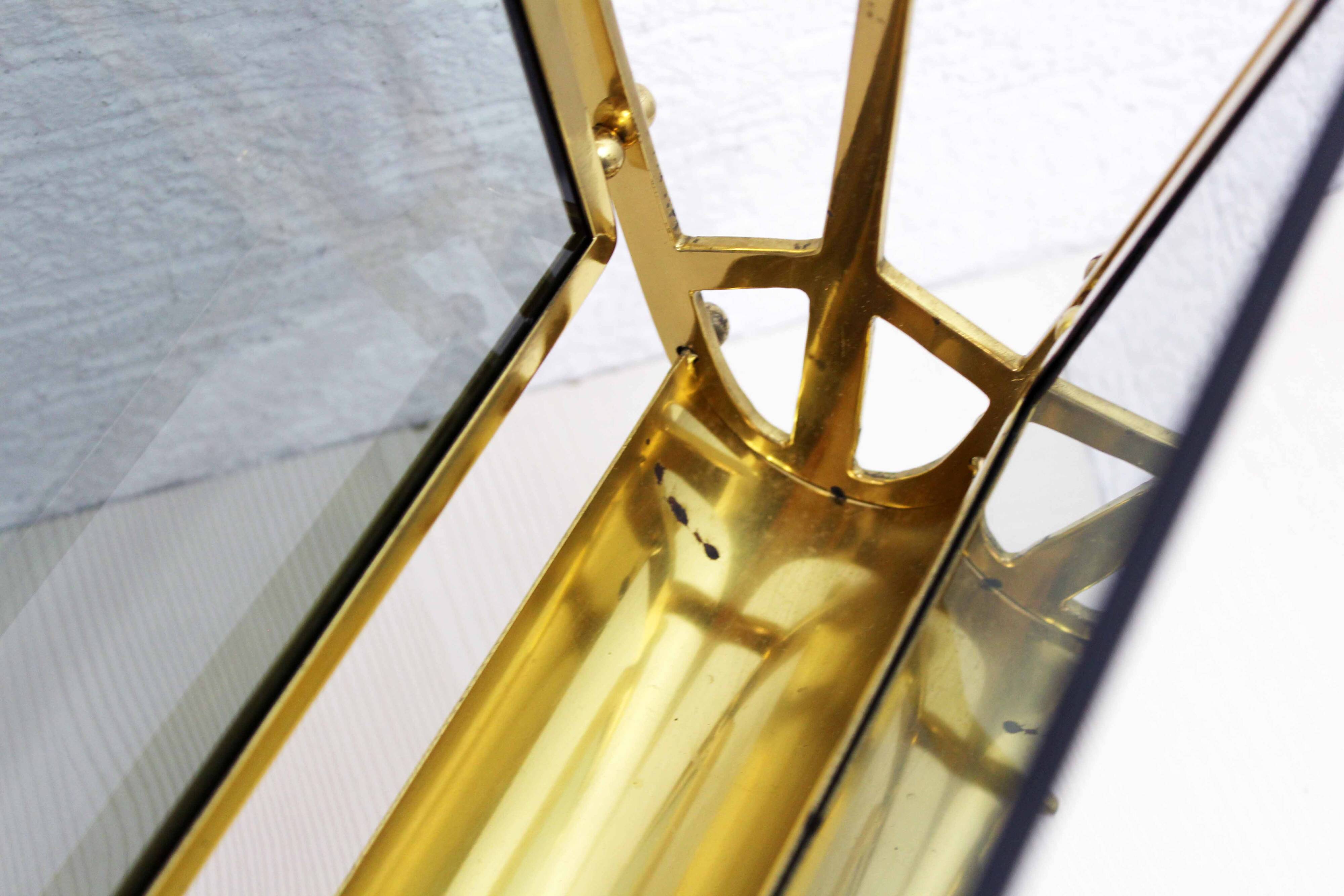 Glass and brass magazine rack, 1970