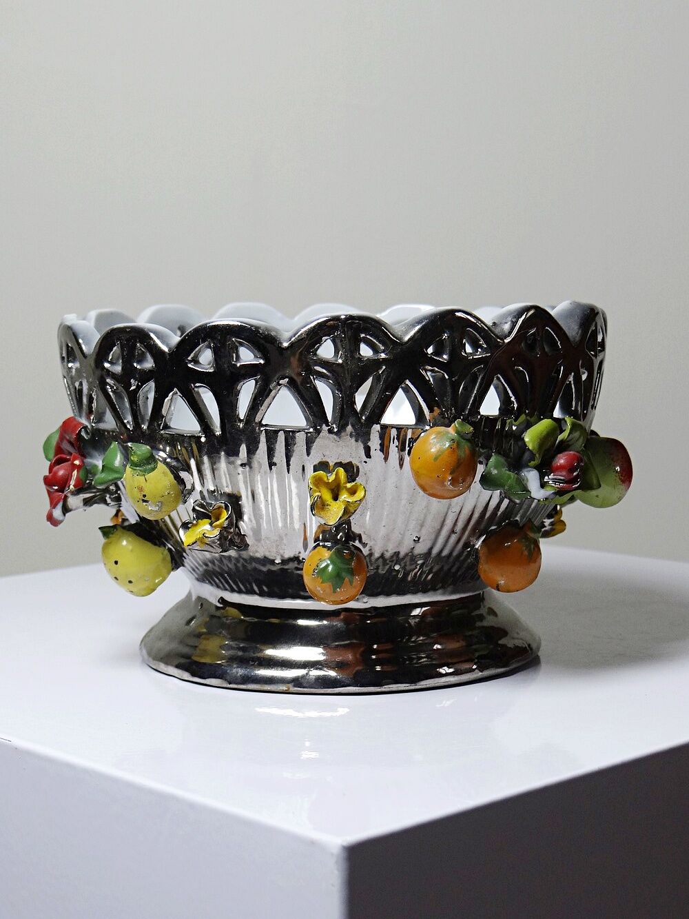 Vintage Italian silver-plated porcelain bowl with cut-out design of fruits and flowers.