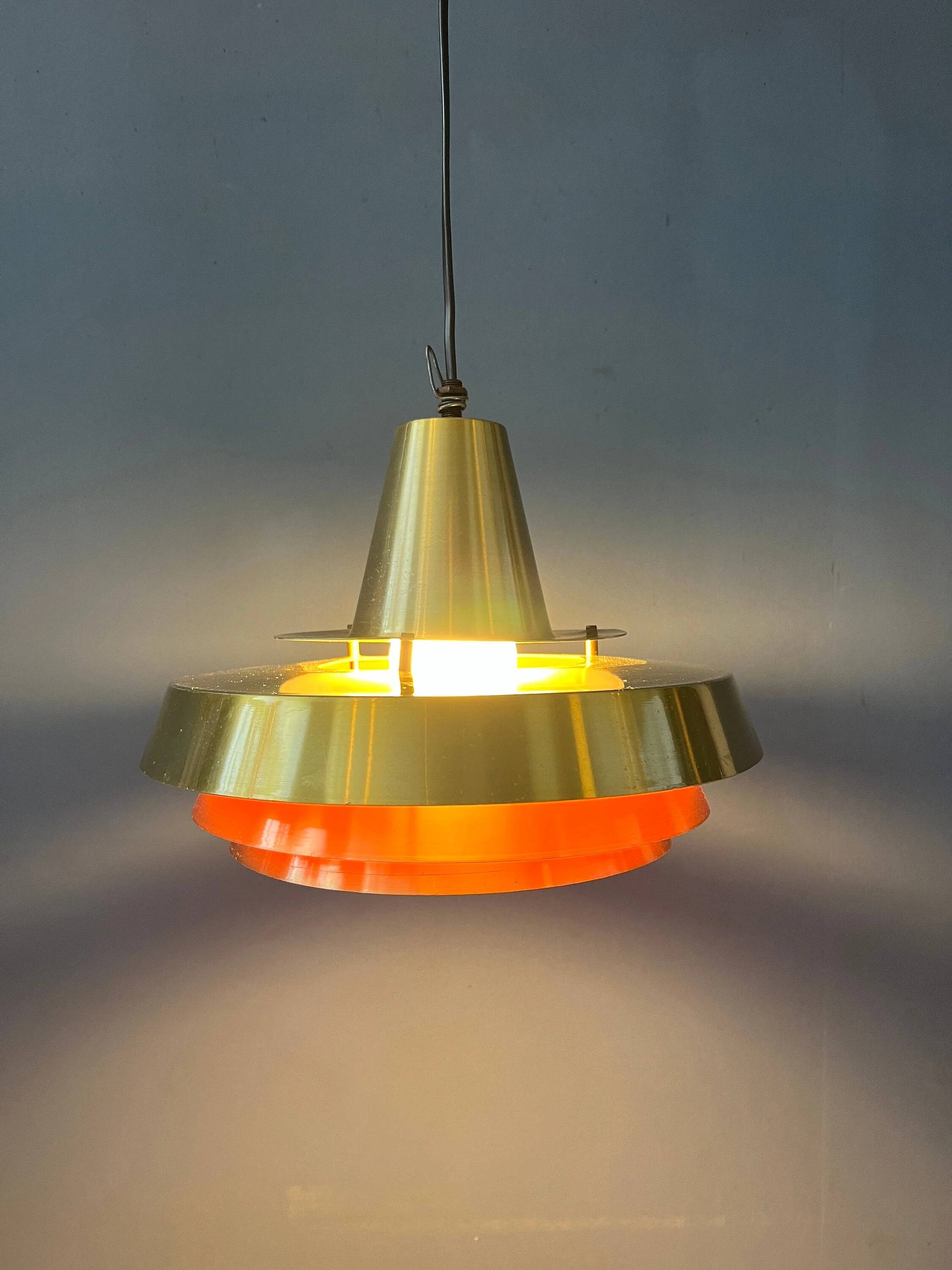 Mid-century Danish style orange brass suspension light.