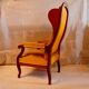 Fauteuil voltaire à oreilles, tissu jaune, XXe siècle