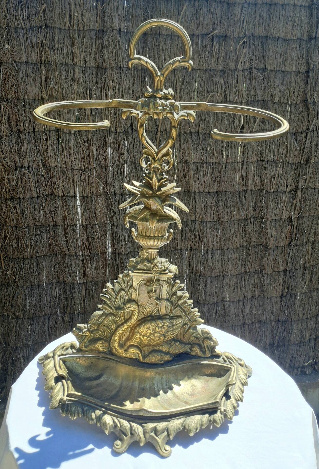 Bronze and brass umbrella stand decorated with a swan.