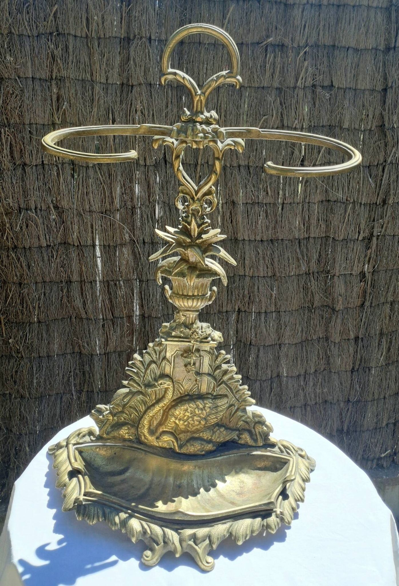 Bronze and brass umbrella stand decorated with a swan.