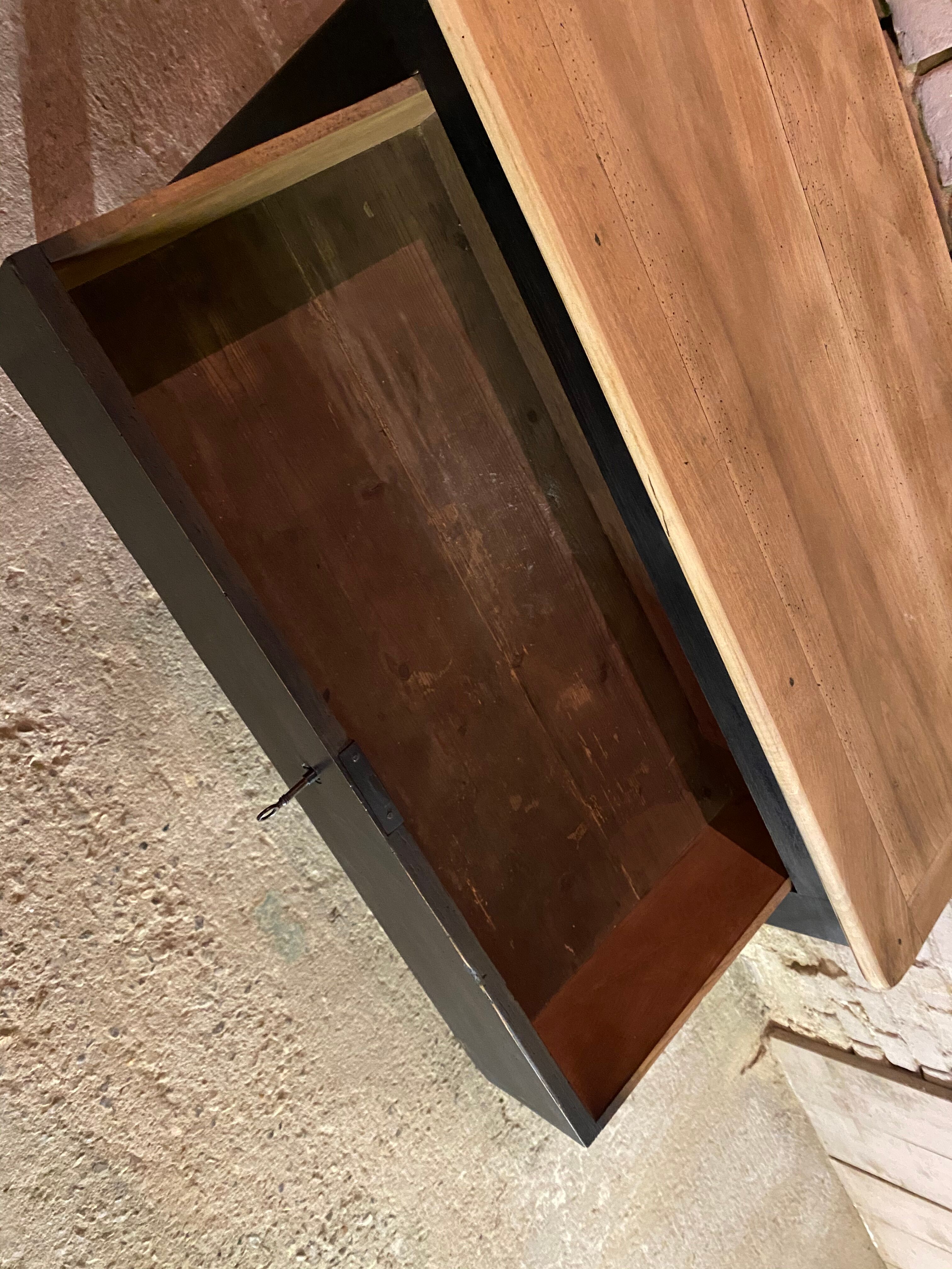 Old black patinated chest of drawers