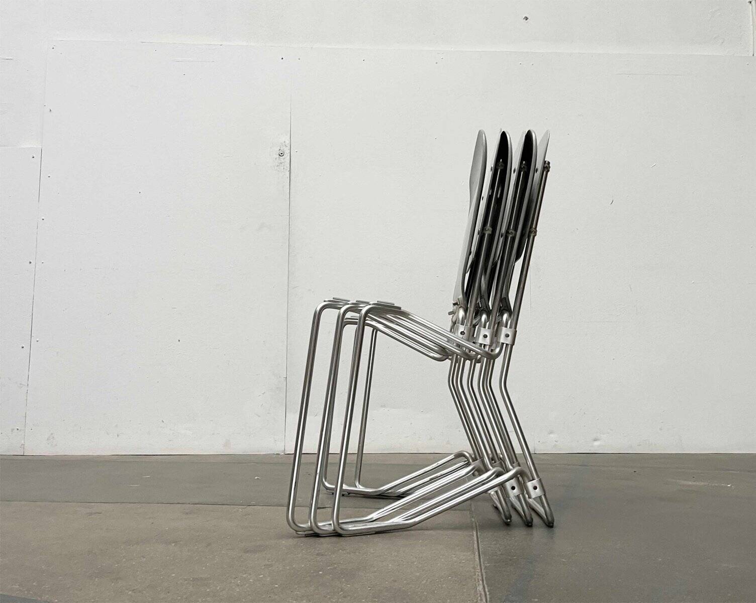 Stackable folding chair in space age style from the mid-century by Armin Wirth for Aluflex, 1960s, set of 3.