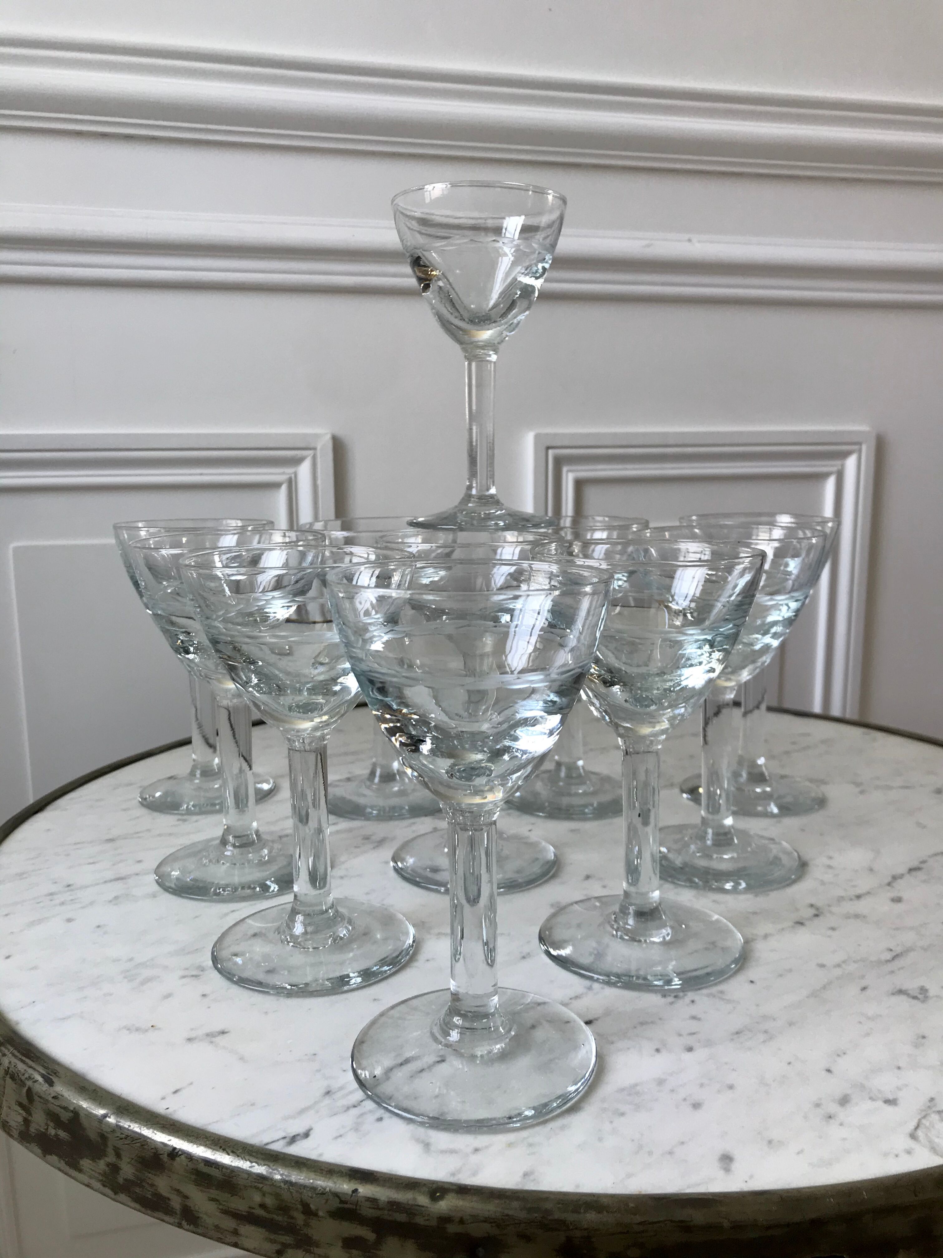 Set of 11 molded glass wine glasses engraved 20s