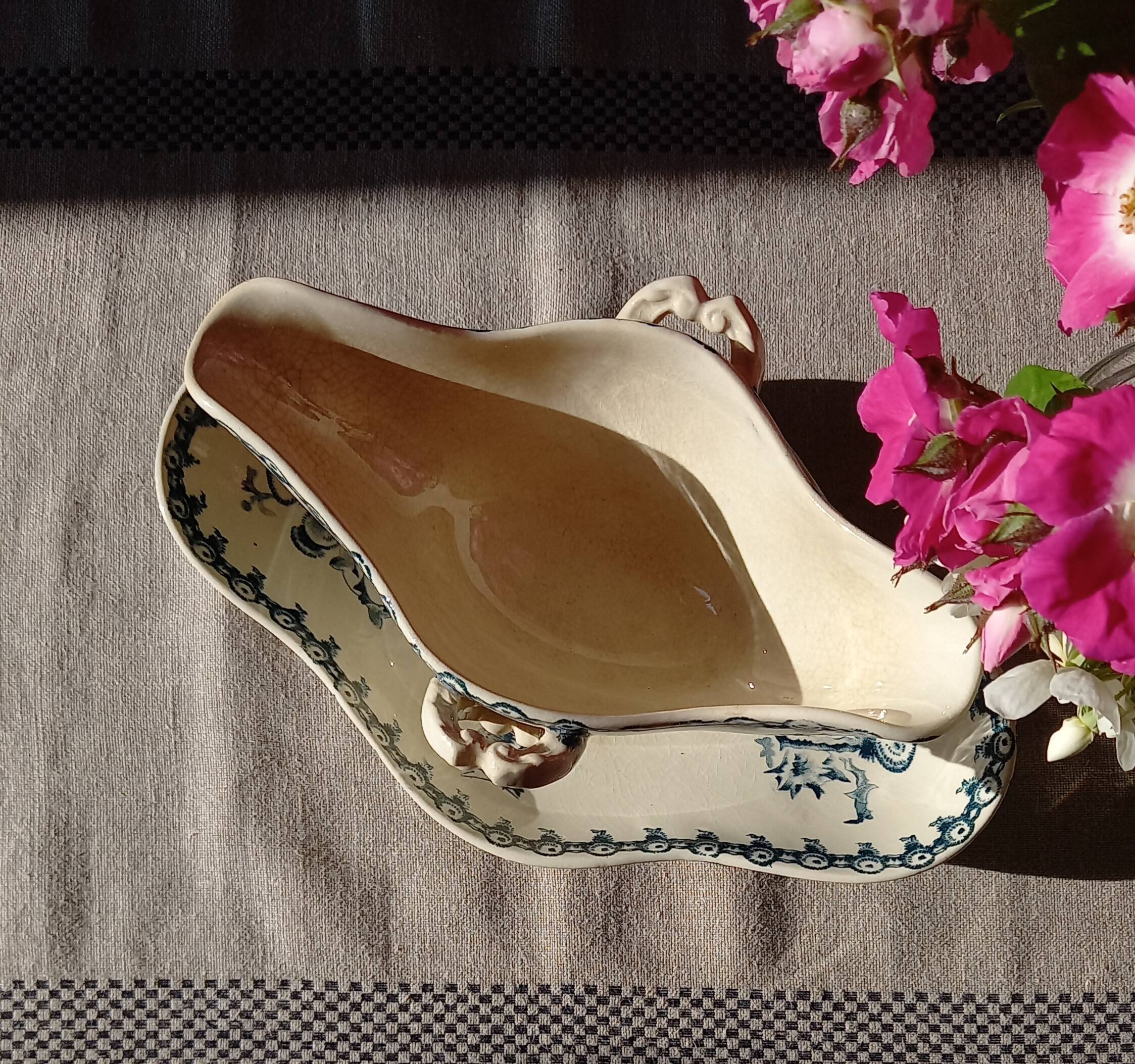 Old gravy boat on frame in terre de fer earthenware by gien, “chardons” model in blue-green