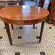 Table ronde en bois avec rallonges intégrées