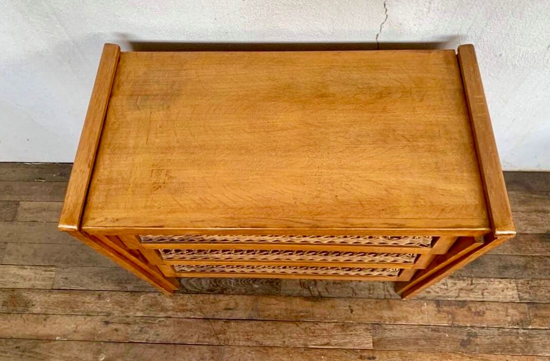 Modernist vintage chest of drawers in light chene has 3 drawers rattan top changing table
