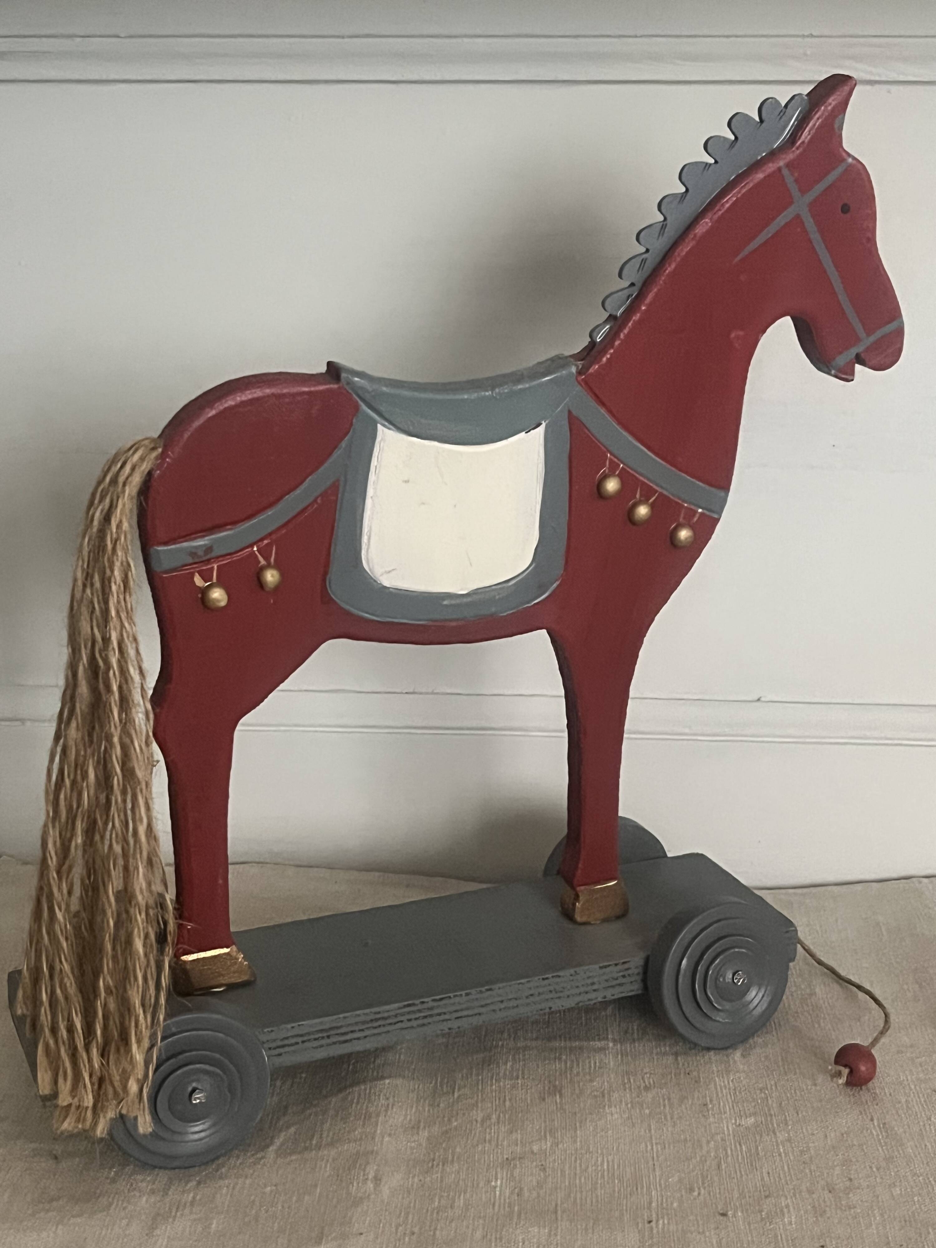 Antique toy, small horse on wheels